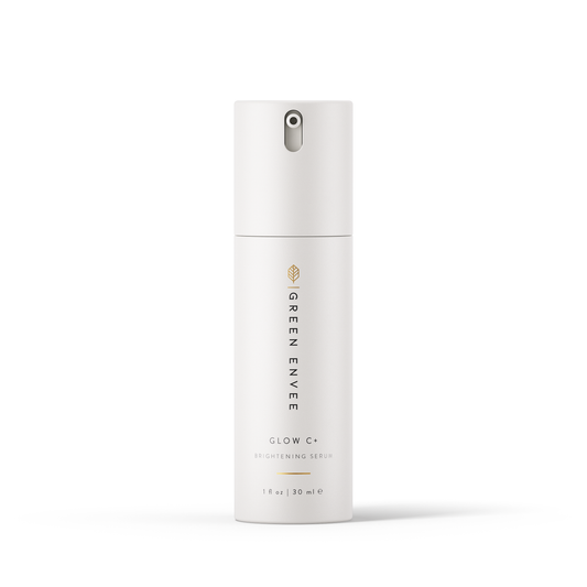 A pump bottle of Glow C+ Brightening Serum by Green Envee with a white and gold label.