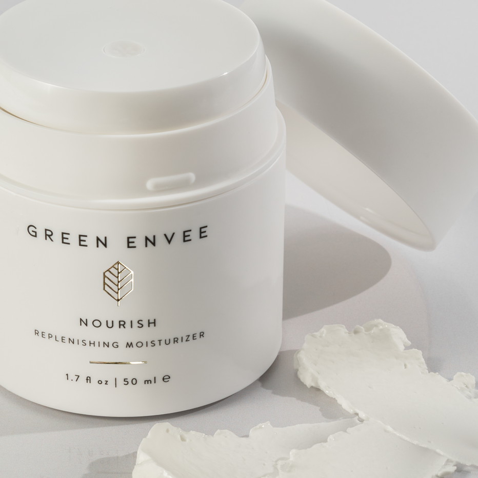 White jar of Green Envee Nourish Replenishing Moisturizer on a light background