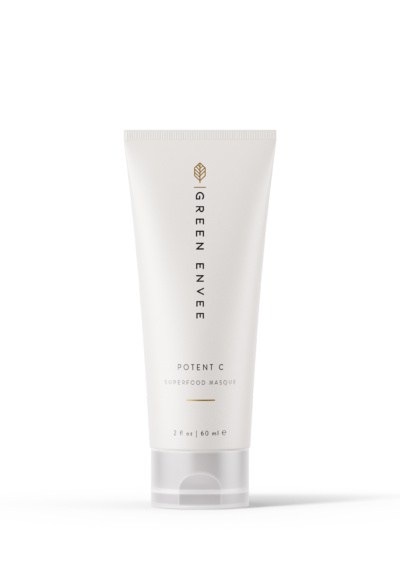 A white tube packaging of 'Potent C Superfood Masque', with green leafy extracts mentioned on the label.