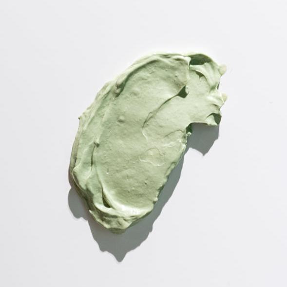 Mint green cream Masque on a light gray background
