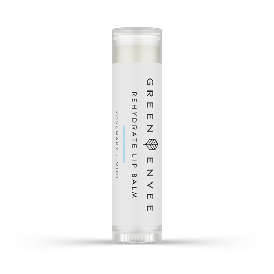 A tube of GREEN Envee REHYDRATE Lip Balm with a white background.