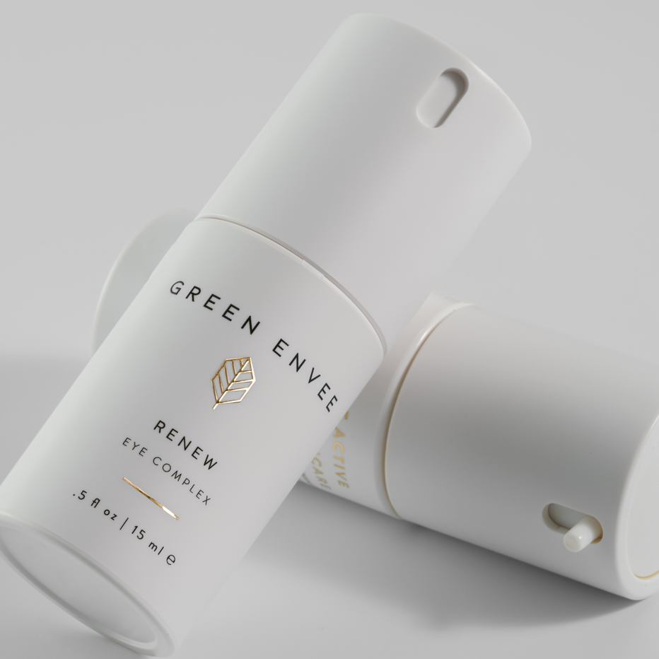 White skincare product container with 'Green Envee' branding on a light gray background