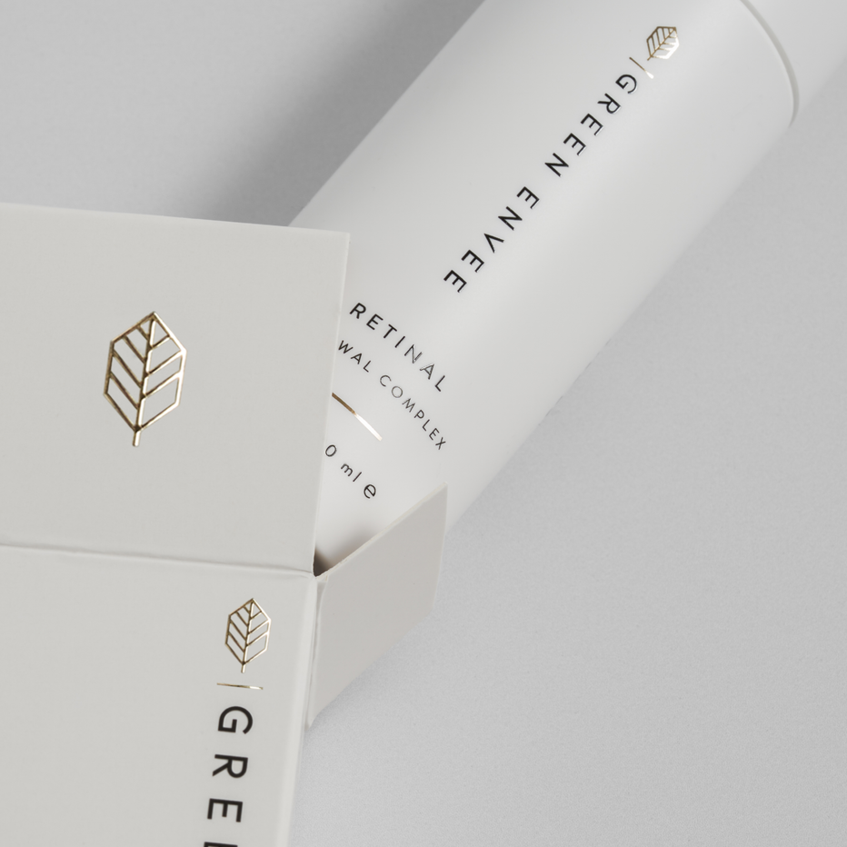 White retinal skincare product packaging with 'Green envee branding on a light gray background